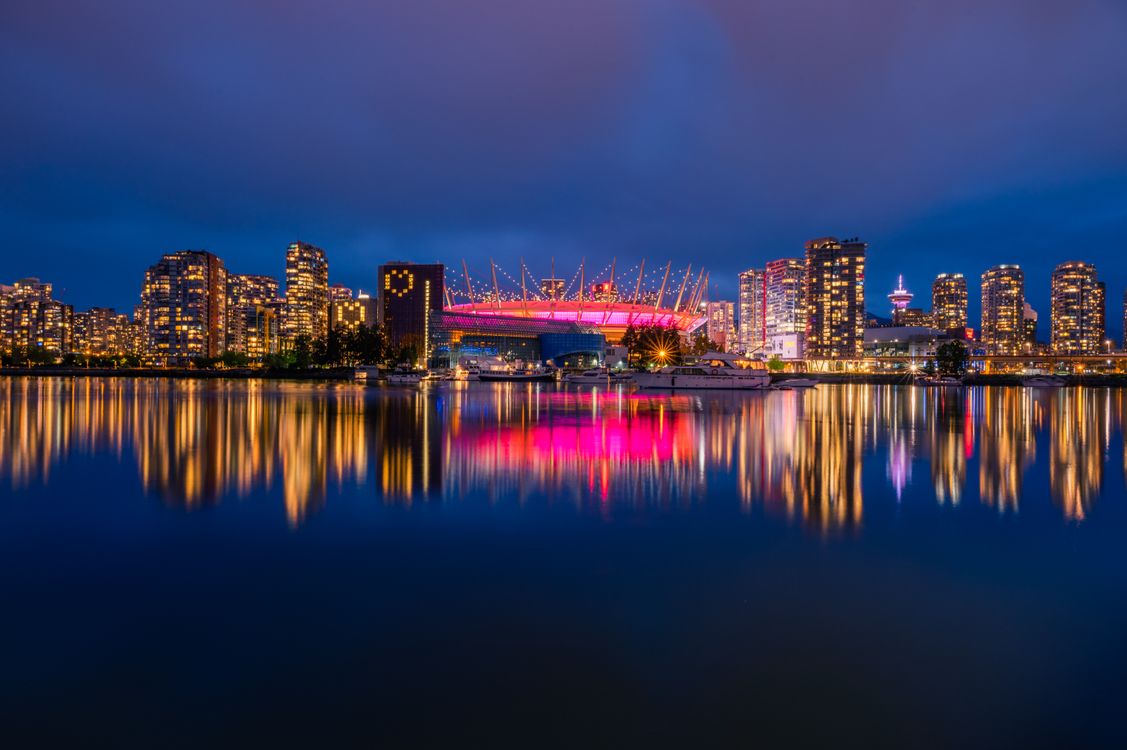 BC Place Stadium night False Creek reflection Vancouver - sports reputation management Rogers Arena